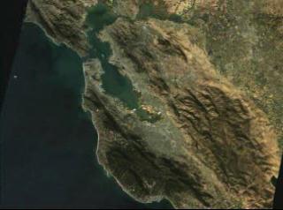 link to multimedia item number 913 entitled 'San Francisco Flyover in Natural Color (321), x 3 Exaggeration.'. Description is 'A flyover of the San Francisco Bay area, using Landsat data draped over terrain data'