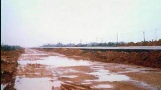 link to multimedia item number 918 entitled 'Ground Photographs from Southern China: Road Development in the Delta'. Description is 'Road development in a delta, requiring significant gravel build-up'