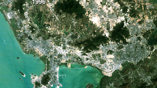 link to multimedia item number 1059 entitled 'Shenzhen, China Land Use - True Color Fade 1988 to 1996 (With Dates)'. Description is 'True color Landsat image with date, Shenzhen, China, 1996.'