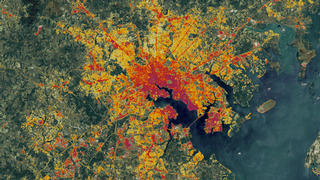 link to multimedia item number 2637 entitled 'Impervious Data of the Baltimore Area'. Description is 'This Landsat data from 1986 of the Baltimore area, however a special algorithm has been applied to it to illuminate the changes in low-density residential land use which exemplify sprawl.'