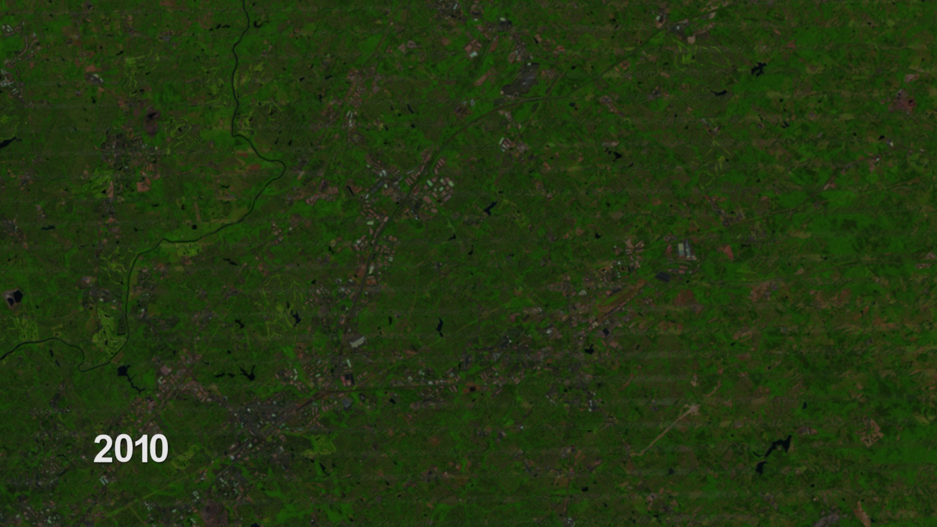 Animation of a Northeastern suburb of Atlanta from 1984 to 2010 through the eyes of Landsat satellite images.  The animation begins with a view of the United States and zooms into the Atlanta suburb, which then cycles through Landsat images of the area from 1984 to 2010.  While the animation moves through time, the viewer should be able to see the Mall of Georgia spring into existence along with the growth of all the surrounding neighborhoods.