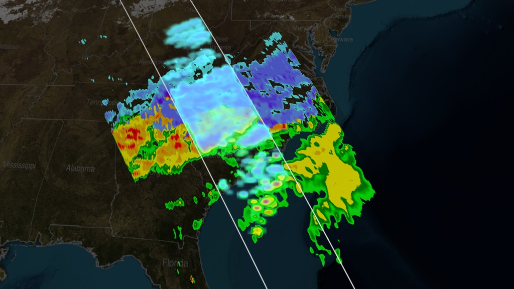 Animation depicting a snowstorm over Kentucky, West Virginia, Virginia, and North Carolina.  A slicing plane reveals the inside of the storm, showing where the precipitation switches from rain (yellow, green, and red) to snow and ice (light blue and purple).This video is also available on our YouTube channel.