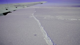 NASA's DC-8 flew over the Pine Island Glacier Ice Shelf on Oct. 14, 2011, as part of Operation IceBridge.  A large, long-running crack was plainly visible across the ice shelf.  The DC-8 took off on Oct. 26, 2011, to collect more data on the ice shelf and the crack.  The area beyond the crack that could calve in the coming months covers about 310 square miles (800 sq. km).