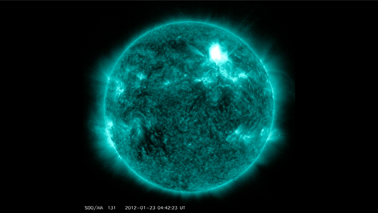 Solar Dynamics Observatory captured the flare, shown here in teal as that is the color typically used to show light in the 131 angstrom wavelength, a wavelength in which it is easy to view solar flares. The flare began at 10:38 PM ET on Jan. 22, peaked at 10:59 PM and ended at 11:34 PM. Credit: NASA/SDO/AIA