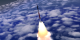 Rocket ascending into space passes by the camera.