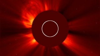 The second of two CMEs from the evening of Feb. 5, 2013, can be seen bursting away from the sun in the upper left hand side of this image, which was captured by the joint ESA/NASA mission the Solar Heliospheric Observatory (SOHO) at 11:12 p.m. EST.  The sun itself is obscured in this picture &mdash taken by an instrument called a coronagraph -- so that its bright light doesn't drown out the picture of the dimmer surrounding atmosphere, called the corona. 