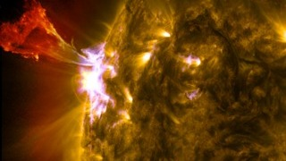 A burst of solar material leaps off the left side of the sun in what's known as a prominence eruption. This image combines three images from NASA's Solar Dynamics Observatory captured on May 3, 2013, at 1:45 pm EDT, just as an M-class solar flare from the same region was subsiding. The images include light from the 131-, 171- and 304-angstrom wavelengths. Credit: NASA/SDO/AIA