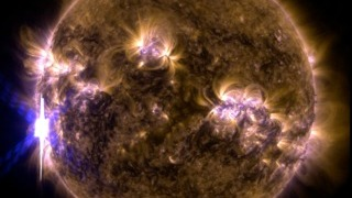 An X-class solar flare erupted on the left side of the sun on the evening of Feb. 24, 2014.  This composite image, captured at 7:59 p.m. EST, shows the sun in ultraviolet light with wavelength of both 131 and 171 angstroms. Credit: NASA/SDO