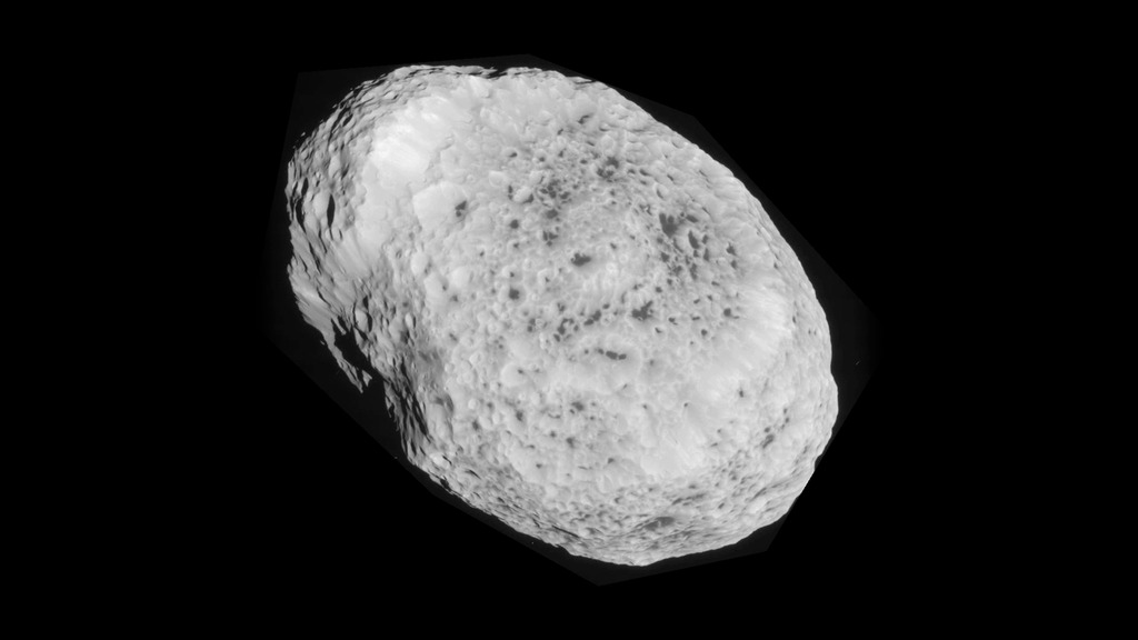 LEAD: On Sunday (May 31, 2015), NASA posted new images of one of Saturn’s moons named Hyperion that was captured during the Cassini spacecraft’s flyby.
1. The irregular craggy moon Hyperion is about 170 miles across and is probably half water ice.
2. The sponge-like appearance is thought to be due, in part, to impacts from meteors, which compress the icy surface.
TAG: This October Cassini will fly within 30 miles of another Saturn moon, Enceladus ‪(enˈselədəs)‬, to study its icy plumes.