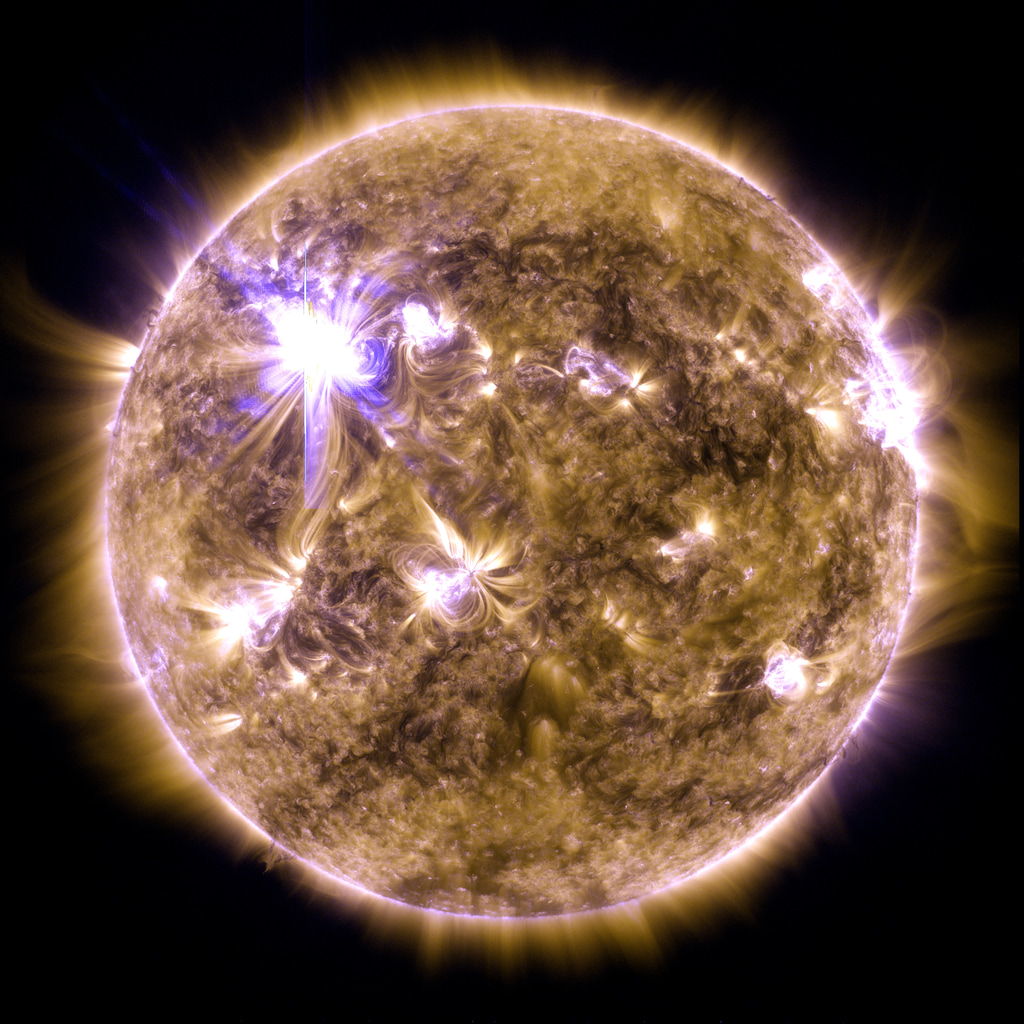 An X5.4 class solar flare flashes in the edge of the Sun on March 07, 2012. This image was captured by NASA's Solar Dynamics Observatory and shows a blend of light from the 171 and 131 angstrom wavelengths. This image was created for the July 31, 2020 issue of ScienceCredit: NASA/GSFC/SDO