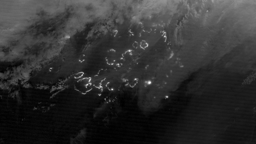 A nighttime view from space reveals actively burning fires.