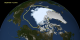 An image of the Arctic sea ice on September 13, 2012, the day that NASA scientists identified to be the minimum area in 2012. The yellow outline shows the average sea ice minimum from 1979 through 2010.  The sea ice is shown with a blue tint.