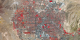 Still image of Las Vegas, 2010, from Landsat data.  This false-color image shows healthy vegetation in red and roads and buildings in gray.  The brightest red colors are mostly golf courses, with a small number of city parks, and one lone wetlands area stretching away from the southwest edge of the city.