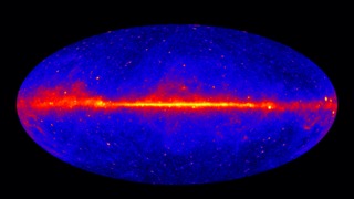 The Fermi LAT 60-month image, constructed from front-converting gamma rays with energies greater than 1 GeV. The most prominent feature is the bright band of diffuse glow along the map's center, which marks the central plane of our Milky Way galaxy. The gamma rays are mostly produced when energetic particles accelerated in the shock waves of supernova remnants collide with gas atoms and even light between the stars.  Hammer projection. Image credit: NASA/DOE/Fermi LAT Collaboration