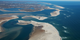 Islands and inlets grow and disappear within 30 years along the shores of Cape Cod.