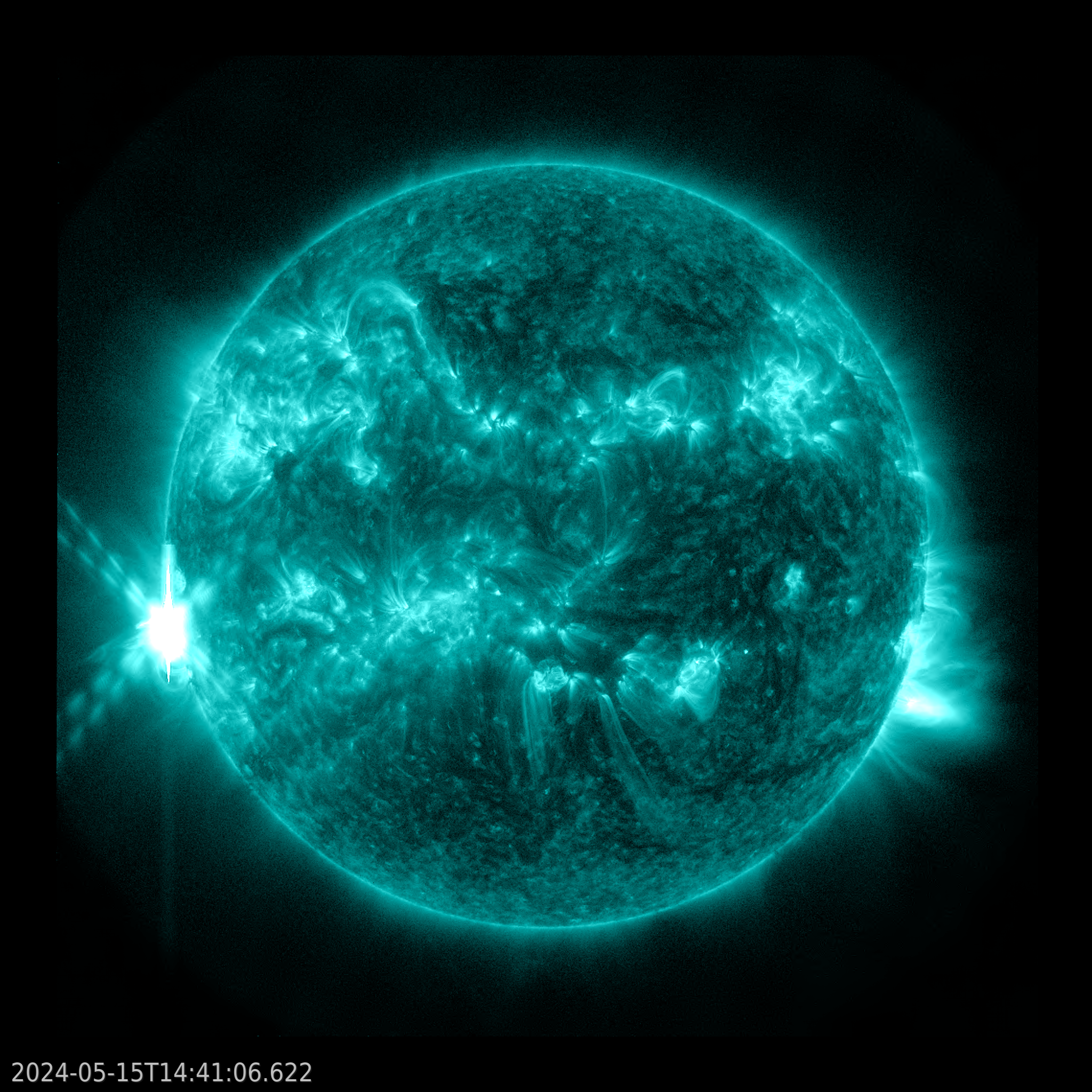 NASA’s Solar Dynamics Observatory captured this image of a solar flare – as seen in the bright flash on the right – on May 15, 2024. The image shows a subset of extreme ultraviolet light that highlights the extremely hot material in flares and which is colorized in teal.Credit: NASA/SDO