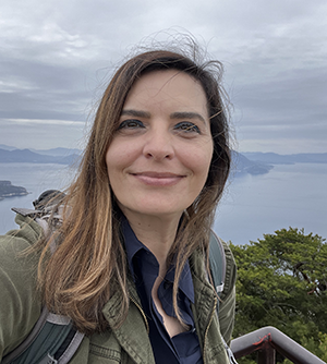 A headshot of Helen-Nicole Kostis.