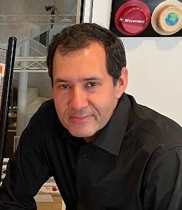A headshot of Mark SubbaRao.