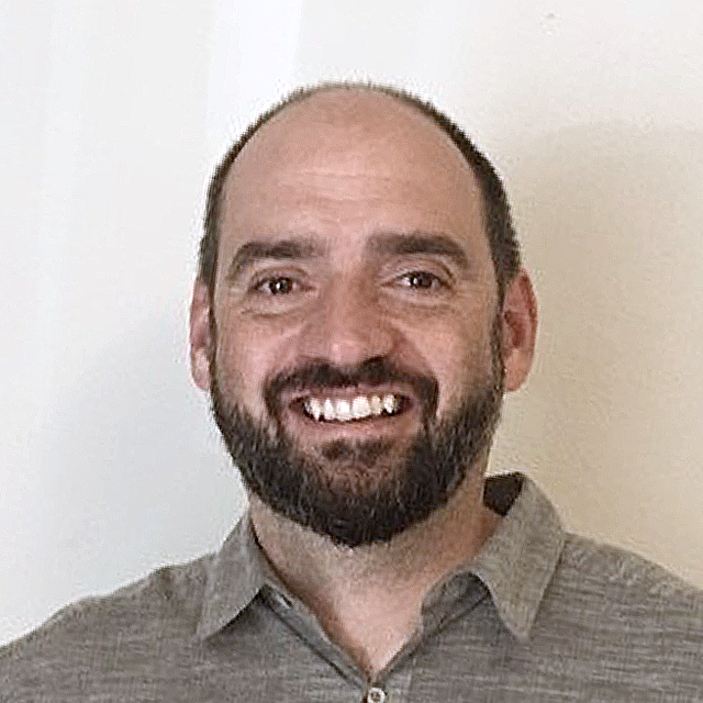 A headshot of Robert Soden.