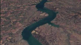 First Images from Landsat 7, South Dakota and the
Missouri River. In this animation the viewer is flown down the Missouri
river and delivered to Yankton, South Dakota, from an image taken April 22, 1998.