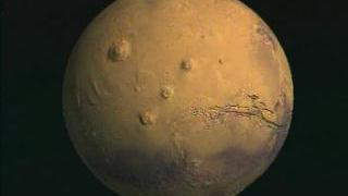 Flyover of Mars topography globe in Tharsis region with true color texture