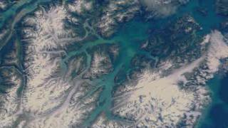 A flyby of Glacier Bay, Alaska, using Landsat imagery draped over elevation data