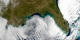 On December 20th 2000 SeaWiFS captured this amazing image of
the east and southern coastal regions of the U.S..  A Wall of clouds
surround the U.S..