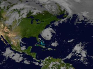 This animation is of Hurricane Isabel on September 17, 2003.  The animation peels away the cloud layer and reveals the storms rain structure.  The yellow isosurface represents areas where at least 0.5 inches ofrain fell per hour.  The green isosurface show 1.0 inches of rain per hour and red displays where more than 2 inches of rain fell per hour. 