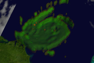 Isabels rain structure:  The yellow isosurface represents areas where at least 0.5 inches of rain fell per hour.  The green isosurface show 1.0 inches of rain per hour and red displays where more than 2 inches of rain fell per hour.