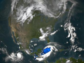 Zooms down to Hurricane Ivan on September 13, 2004.  It looks underneath of the storms clouds to reveal the underlying rain structure.  Blue represents areas with at least 0.25 inches of rain per hour.  Green shows at least 0.5  inches of rain per hour.  Yellow is at least 1.0 inches of rain and Red is at least 2.0 inches of rain per hour.