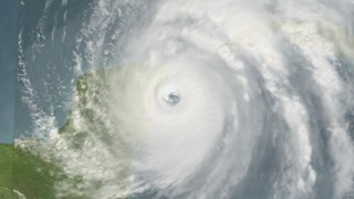 October 21, 2005, Terra/MODIS captures this image of Hurricane Wilma making landfall at the Yucatan Penisula.