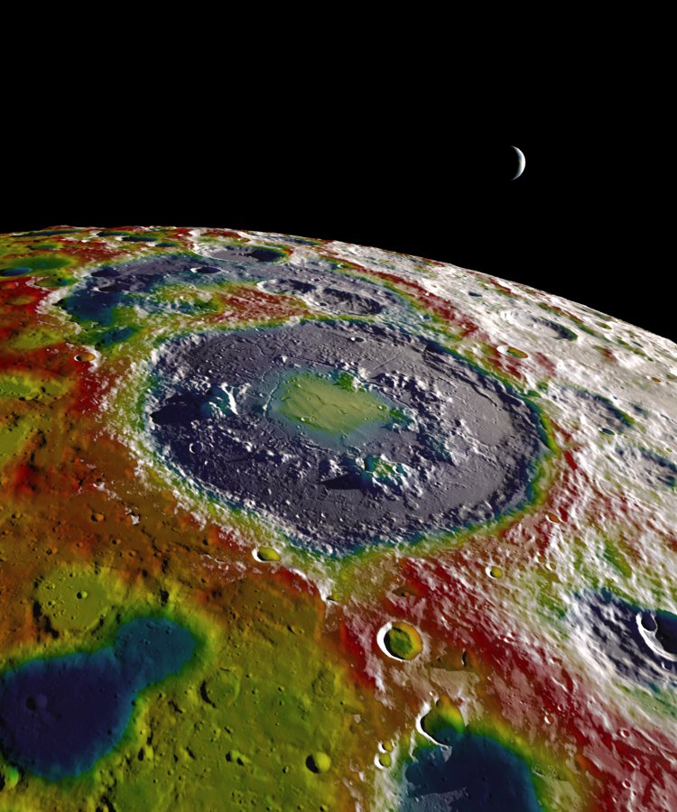 A high-resolution free-air gravity map based on GRAIL data, overlaid on terrain based on LRO altimeter (LOLA) and camera (LROC) data. The view is south-up, with the south pole near the horizon in the upper left and the crescent Earth in the distance. The terminator crosses the eastern rim of the Schr&#x00F6;dinger basin. Gravity is painted onto the areas that are in or near the night side. Red corresponds to mass excesses and blue to mass deficits.