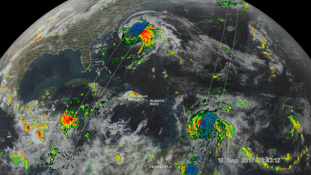The Global Precipitation Measurement (GPM) mission shows the rainfall distribution for two major storms churning in the Atlantic and Caribbean basins. The visualization shows Hurricane Jose as it continues to slowly move northward off the US East Coast east of the Outer Banks of North Carolina. At one time, Jose was a powerful category 4 border line category 5 storm with maximum sustained winds reported at 155 mph by the National Hurricane Center back on the 9th of September as it was approaching the northern Leeward Islands. Jose passed northeast of the Leeward Islands as a category 4 storm on a northwest track and then began to weaken due to the effects of northerly wind shear. Remaining over warm water allowed Jose to strengthen back into a hurricane on September 15th as wind shear across the storm diminished. At this time, Jose was still only midway between the central Bahamas and Bermuda, having just completed its loop, and moving to the northwest. On the 16th, Jose turned northward as it moved around the western edge of a ridge of high pressure near Bermuda and began to parallel the US East Coast well away from shore. An overpass by the GPM Core Observatory captured an image of Jose overnight at 3:36 UTC 18 September (11:36 pm EST 17 September) as the storm was moving due north at 9 mph well off shore from the coast of North Carolina. The GPM image estimated areas of very heavy rain on the order of 75 mm/hr (~3 inches per hour). 

The GPM Core Observatory satellite also had an excellent view of Hurricane Maria when it passed almost directly above the hurricane on September 17, 2017 at 1001 PM AST (September 18, 2017 0201 UTC). GPM's Microwave Imager (GMI) and Dual-Frequency Precipitation Radar (DPR) showed that Maria had well defined bands of precipitation rotating around the eye of the tropical cyclone. GPM's radar (DPR Ku band) found rain falling at a rate of over 6.44 inches (163.7 mm) per hour in one of these extremely powerful storms northeast of Maria's eye. Intense thunderstorms were found towering to above 9.7 miles (15.7 km). This kind of chimney cloud is also called a "hot tower" (as it releases a huge quantity of latent heat by condensation). These tall thunderstorms in the eye wall are often a sign that a tropical cyclone is becoming more powerful. Maria rapidly intensified following this view to a Category 5 storm on September 19th.