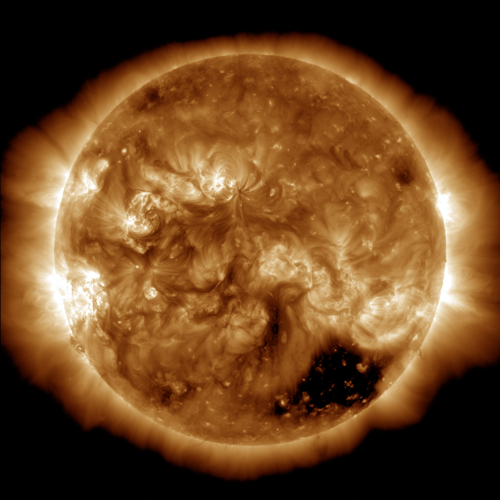 A sample of solar coronal holes around the time of the maximum of sunspot activity (April 2014).  Note the polar regions are devoid of coronal holes but a large hole appears in the southern hemisphere.