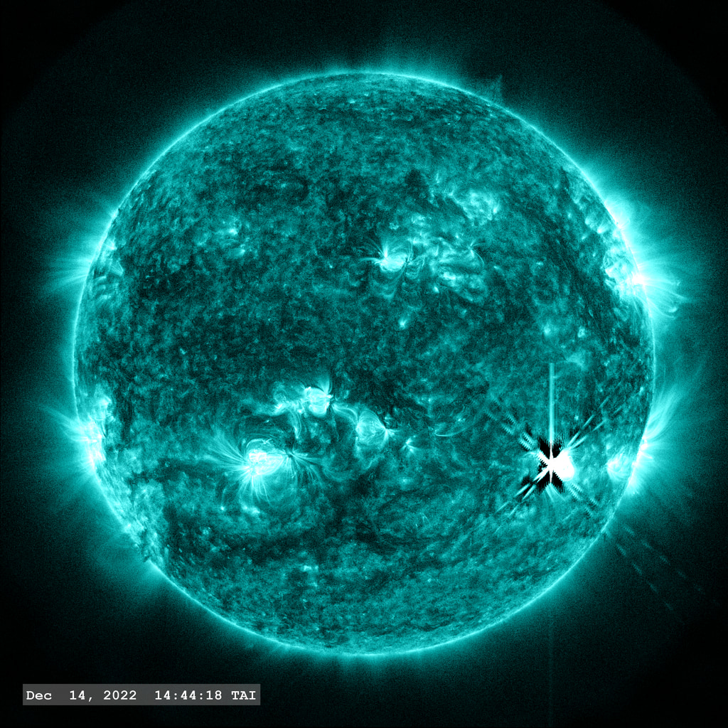 The double flare event (M6.3 & M 3.2) of December 14, 2022 as seen in the SDO AIA 131 angstrom filter.  The dark region around the central 'X' marking the flare is an artifact of the PSF correction.  'Flickering' in the images around the flare are created due to the 'flare mode' images which have a shorter exposure.  Normalizing the solar disk to the same brightness in these frames enhances the background noise off the solar disk.