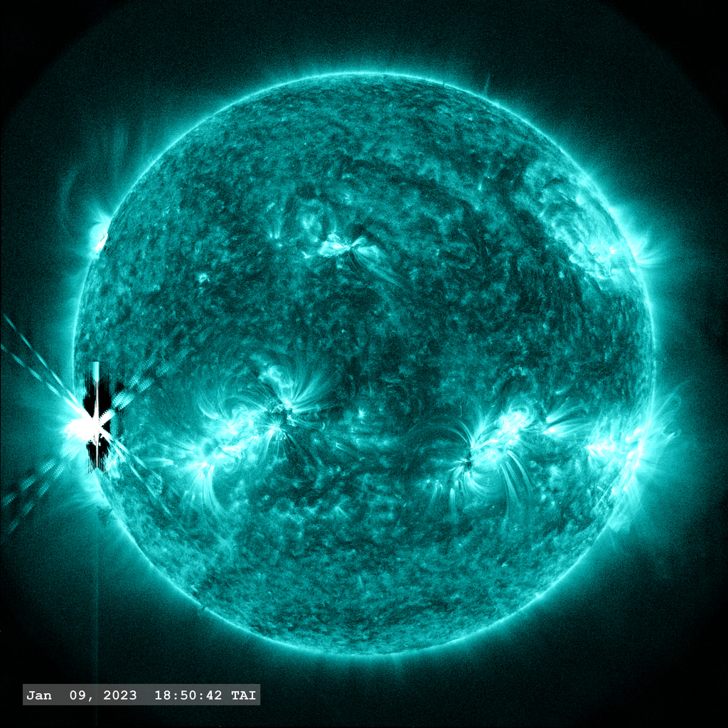The X1.9 flare event of January 9, 2023 as seen in the SDO AIA 131 angstrom filter. Two smaller M-class flares occur at later times on other regions on the solar  disk.  The dark region around the central 'X' marking the flare is an artifact of the PSF correction. 'Flickering' in the images around the flare are created due to the 'flare mode' images which have a shorter exposure. Normalizing the solar disk to the same brightness in these frames enhances the background noise off the solar disk.