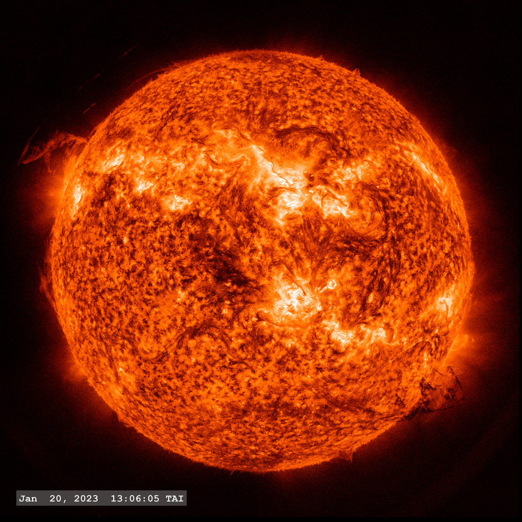 In this imagery from the SDO/AIA 304 angstrom filter, a large solar filament hovers above the solar surface (lower right) for several hours before eventually launching into space.