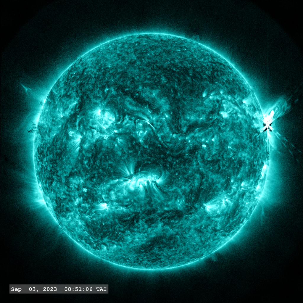 The M 6.0 flare erupts on the right limb of the Sun in this view from SDO/AIA 131 angstrom filter.  A nice coronal loop arcade forms afterwards.  The point-spread function correction (PSF) has been applied to all this imagery.