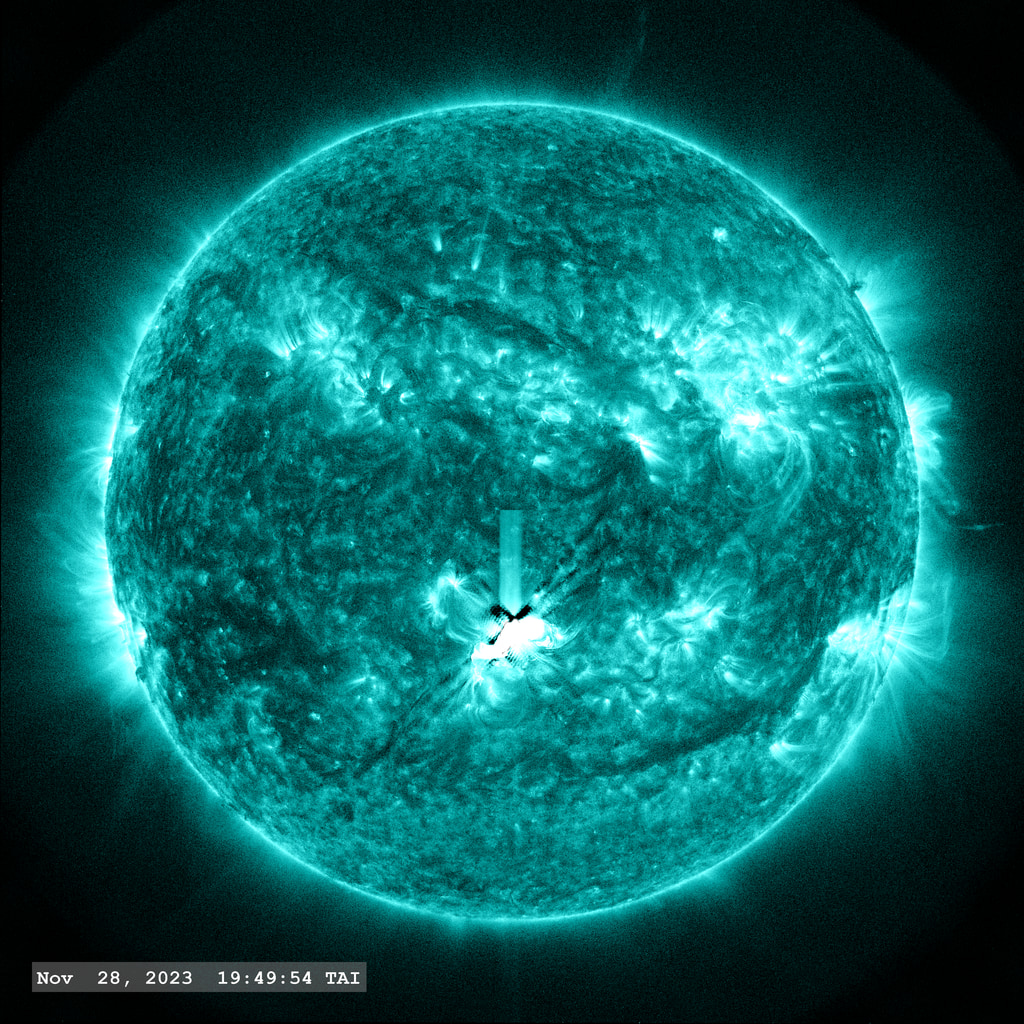 The M 9.8 flare (just short of an X-class flare) erupts on the lower center of the solar disk in this view from SDO/AIA 131 angstrom filter. A nice coronal loop arcade forms afterwards. The point-spread function correction (PSF) has been applied to all this imagery.