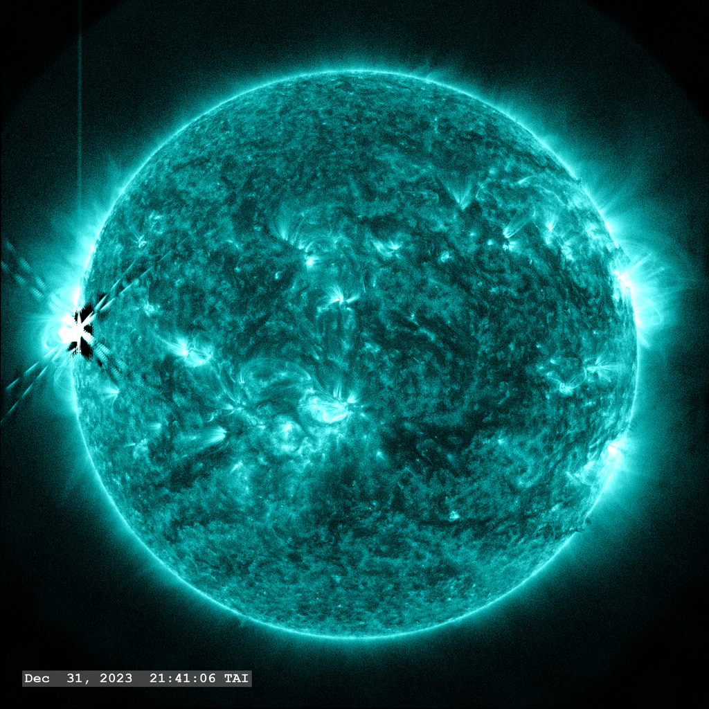 Active Region 13536 ends 2023 with a bang as it releases an X5.0 flare as it comes around the left solar limb in this view from the SDO/AIA 131 angstrom filter.