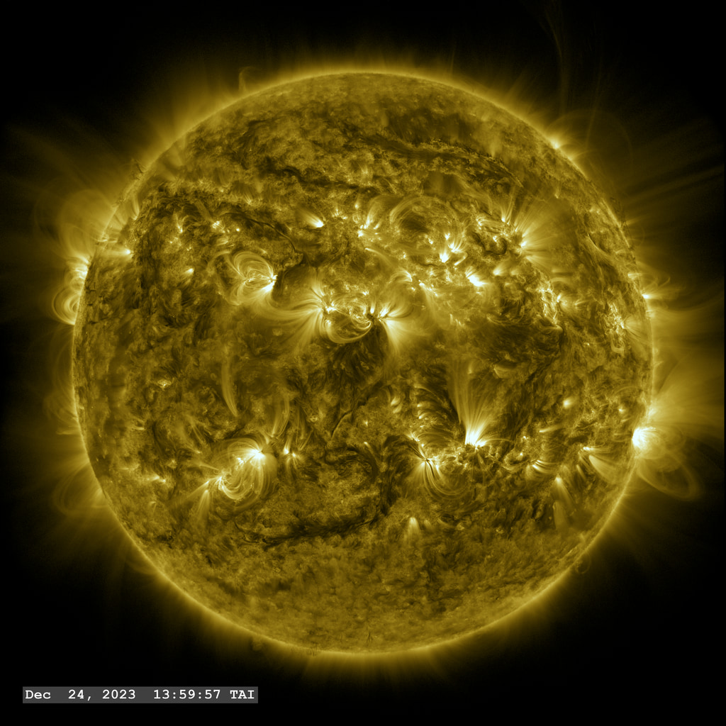 This view of the Sun, through the SDO/AIA 171 angstrom filter, reveals the flows of hot plasma along the magnetic field lines, glowing from the emission of light by ionized iron atoms which have lost eight electrons (aka Fe IX).