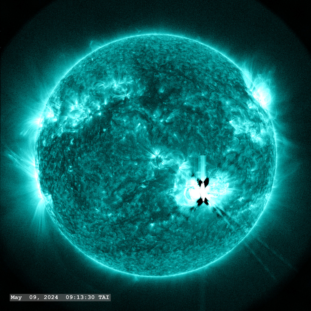 Active Region 13664 (in the lower right quadrant) launches a strong flare (X2.2) in this view through the SDO AIA 131 ångstrom filter.