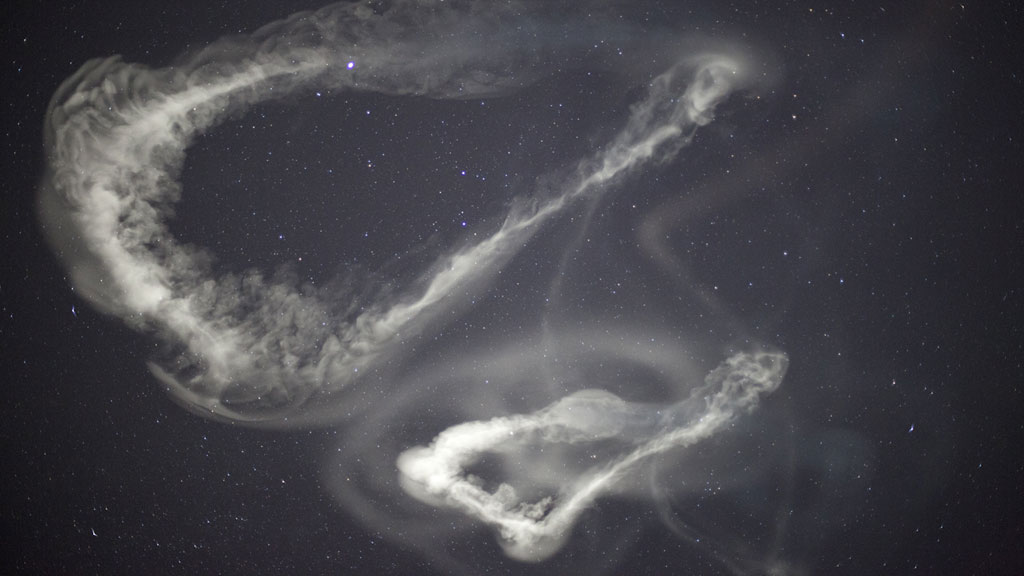 Artificial clouds illuminate a jet stream at the edge of space.