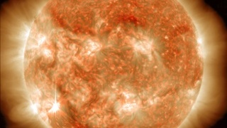 Visible in the lower left corner, the sun emitted an M6 solar flare on Nov. 13, 2012, which peaked at 9:04 p.m. EST. This image is a blend of two images captured by NASA's Solar Dynamics Observatory (SDO), one showing the sun in the 304 