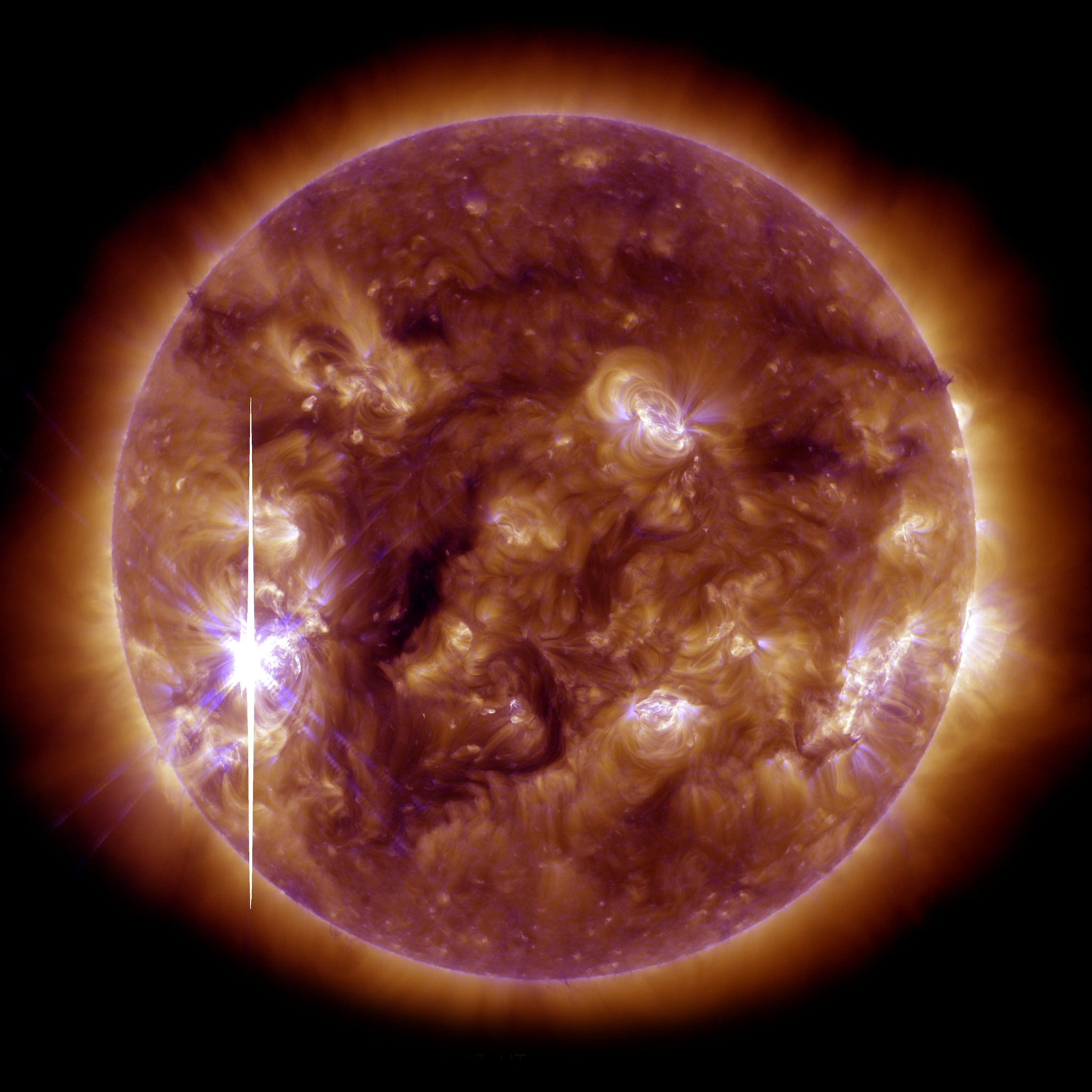 X3.3 flare from 22:15 UT on Nov 5, 2013.  This image is a blend of SDO AIA 193 and 131 angstrom wavelengths.
