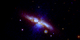 Swift's UVOT captured the new supernova in three exposures taken on Jan. 22, 2014. Mid-ultraviolet light is shown in blue, near-UV light in green, and visible light in red. Thick dust in M82 scatters much of the highest-energy light, which is why the supernova appears yellowish here. The image is 17 arcminutes across, or slightly more than half the apparent diameter of a full moon.  Credit: NASA/Swift/P. Brown, TAMU