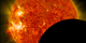 NASA's Solar Dynamics Observatory captured this image of the moon crossing in front of its view of the sun on Jan. 30, 2014, at 10:30 a.m. EST in 171 and 304 angstrom light. The two wavelengths are blended together.   Credit: NASA/SDO