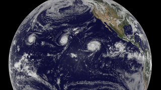NASA observes three powerful storms simultaneously whipping across the Pacific Ocean.