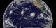 NASA observes three powerful storms simultaneously whipping across the Pacific Ocean.