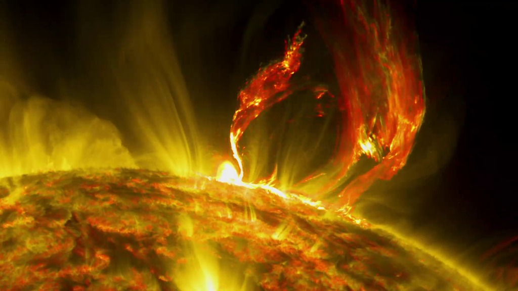 LEAD: NASA caught a spectacular solar eruption this June. 1. The solar explosion threw out a giant cloud of solar  material. 2. The activity is shown here in ultraviolet light that has been colorized in red. TAG: The surface temperature of the sun is over 10,000 degrees Fahrenheit.